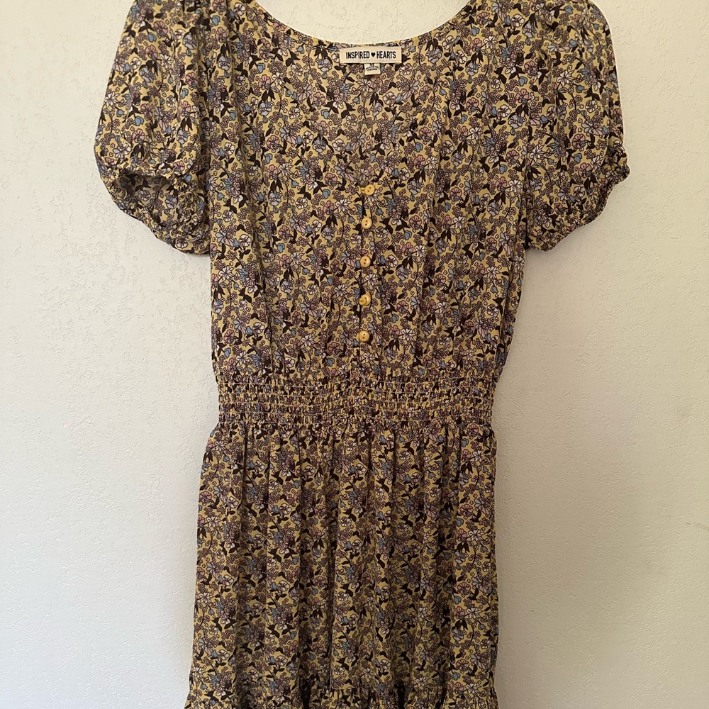 Yellow dress with blue/white/pink floral designs and puffed sleeves